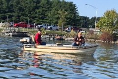 T.J. and friend in the MirroCraft and Evinrude Big Twin 25